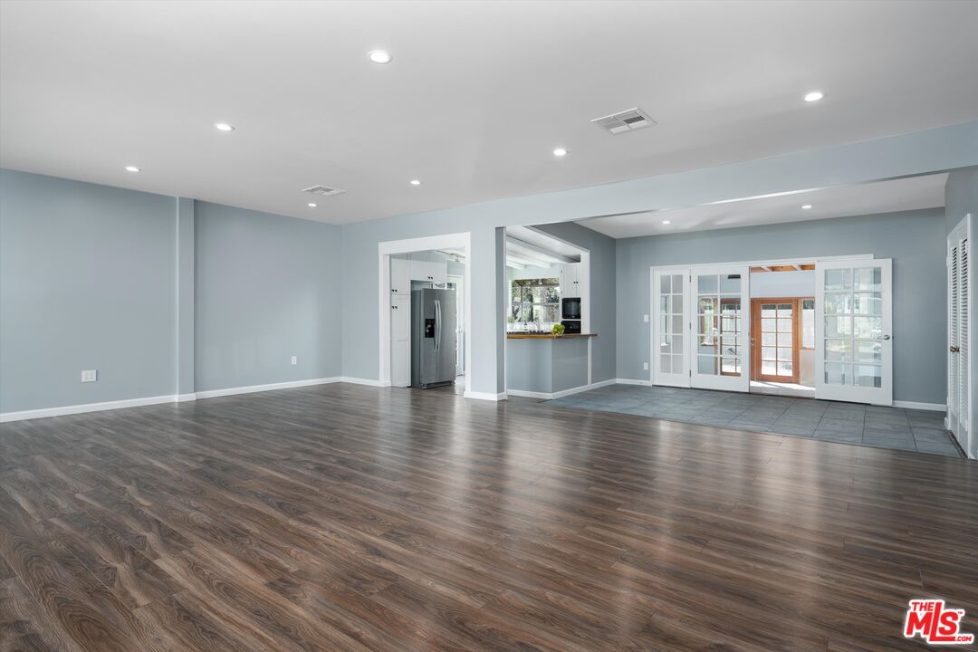 3061 Highview Avenue Altadena, CA 91001 - Photo 4 of 30 a view of an empty room with wooden floor and a window