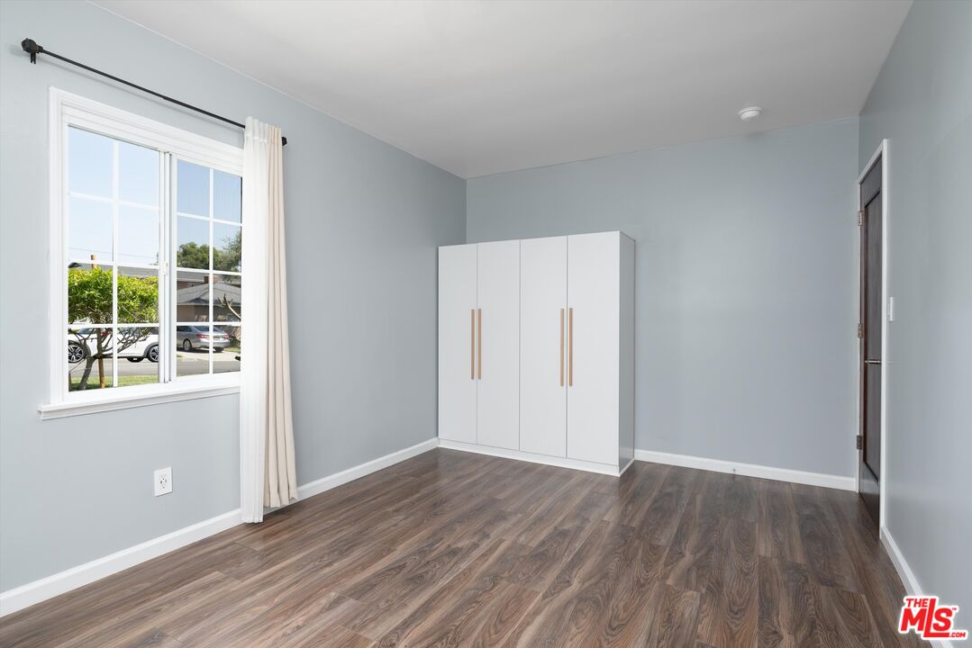3061 Highview Avenue Altadena, CA 91001 - Photo 7 of 30 an empty room with wooden floor and windows