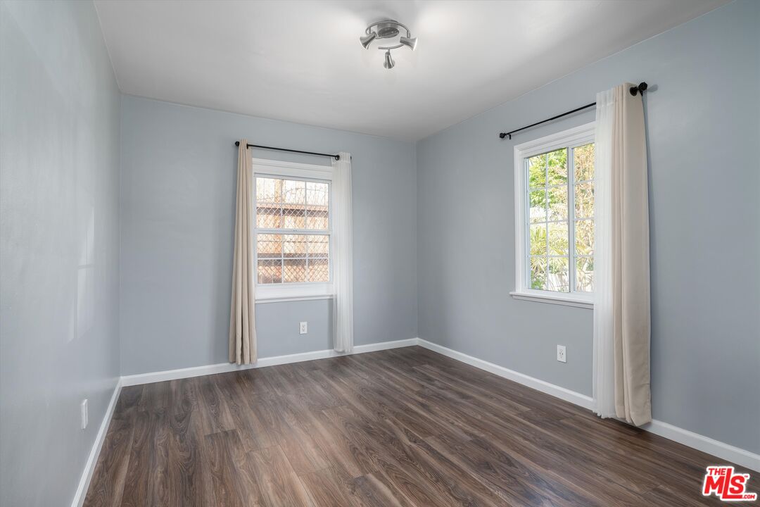 3061 Highview Avenue Altadena, CA 91001 - Photo 8 of 30 a view of an empty room with wooden floor and a window