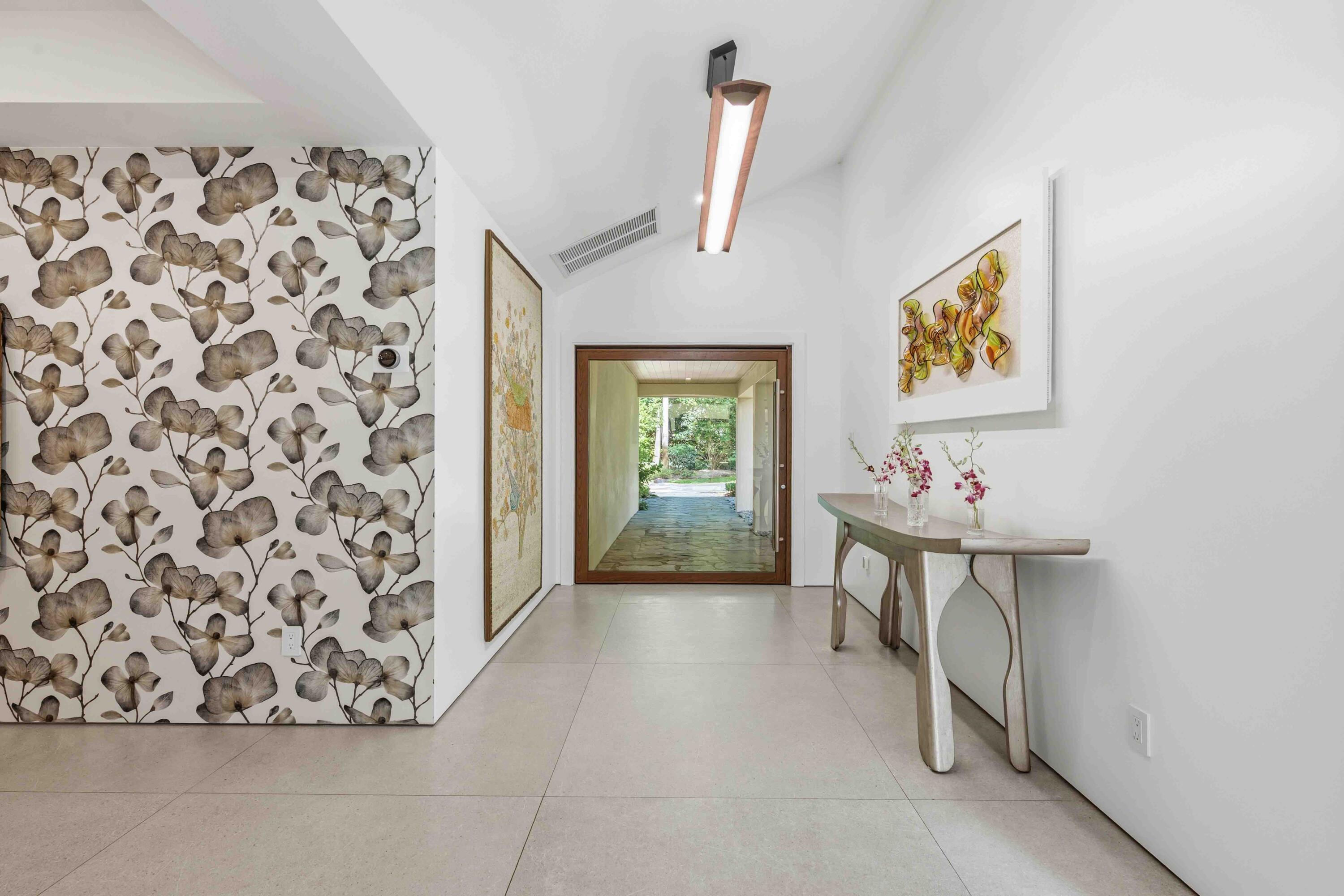18660 Long Lake Drive Boca Raton, FL 33496 - Photo 11 of 75 a view of a hallway with paintings on the wall