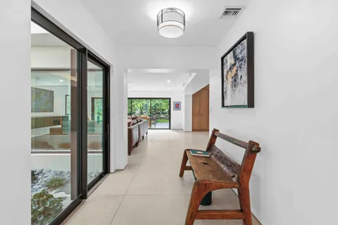 a kitchen with a table and chairs