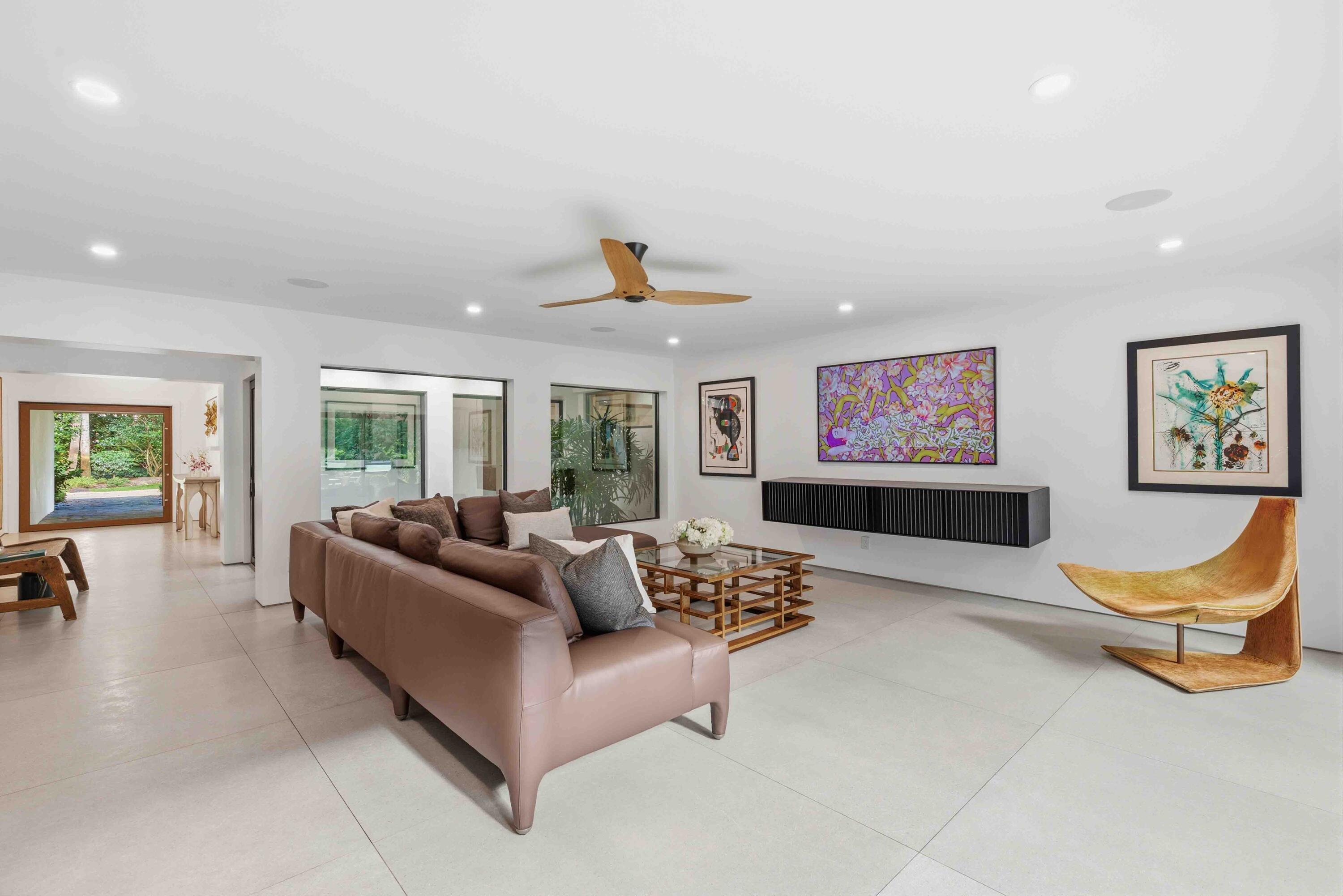 18660 Long Lake Drive Boca Raton, FL 33496 - Photo 29 of 75 a living room with furniture and a flat screen tv