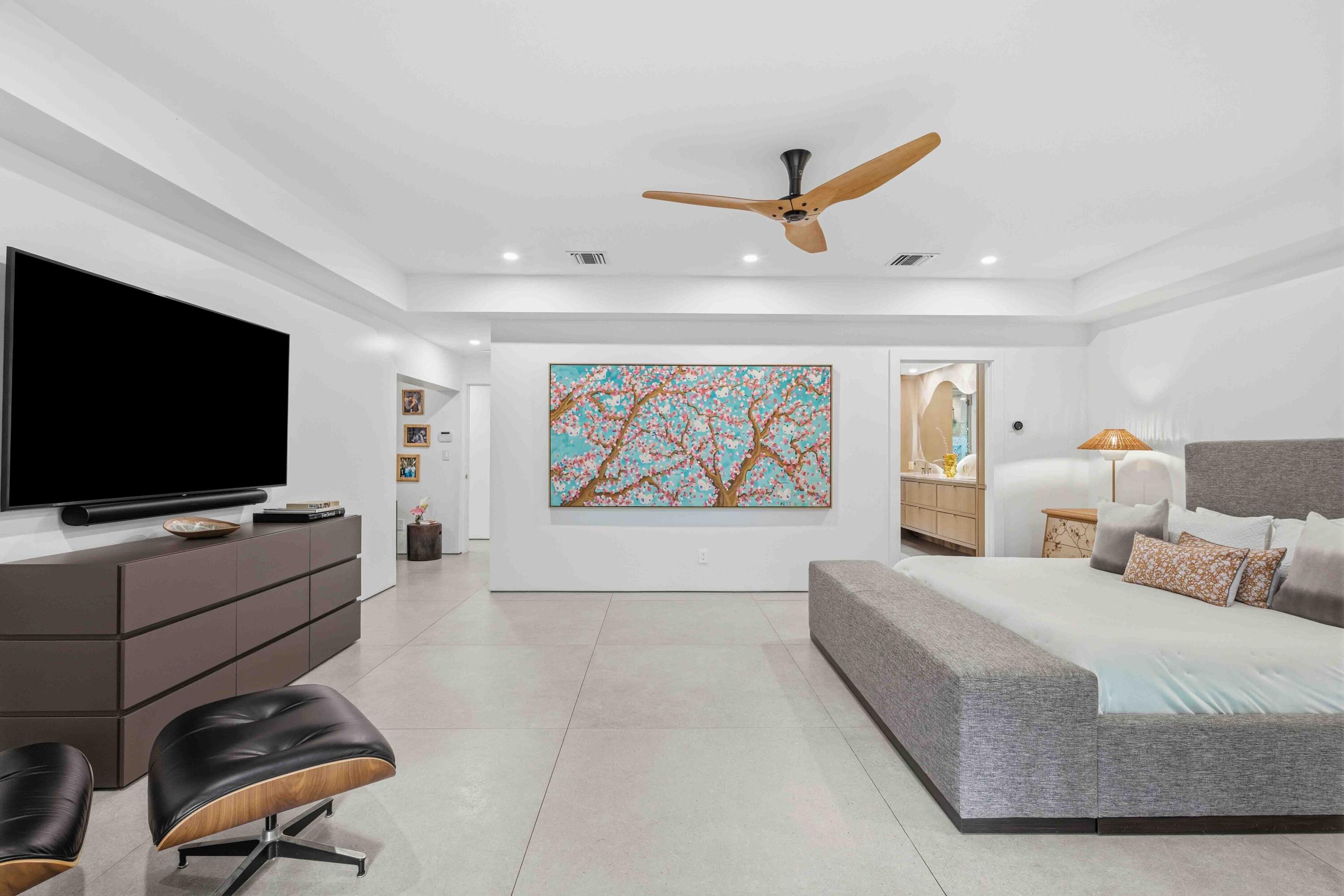 18660 Long Lake Drive Boca Raton, FL 33496 - Photo 33 of 75 a spacious bedroom with a bed and a flat screen tv