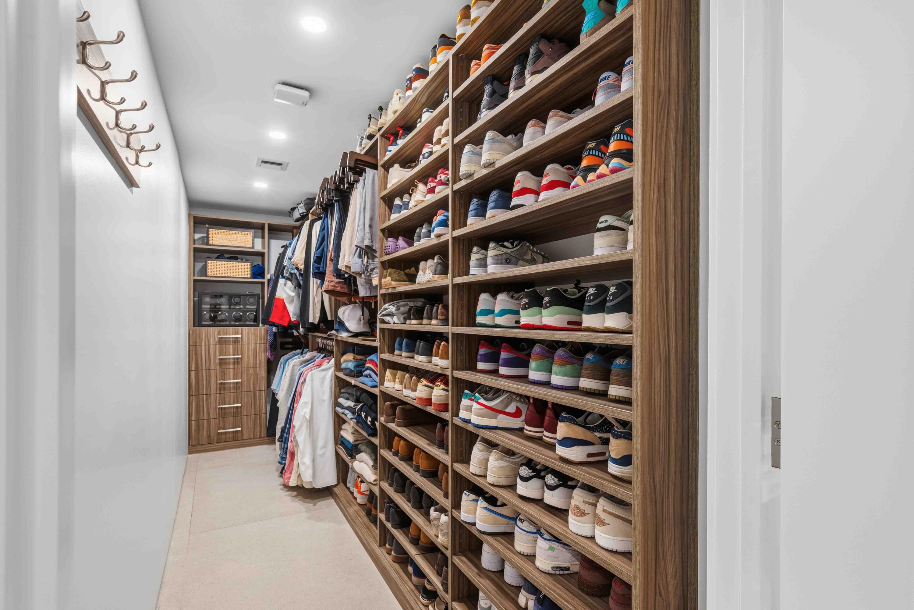 18660 Long Lake Drive Boca Raton, FL 33496 - Photo 40 of 75 a view of walk in closet with clothes and shoes
