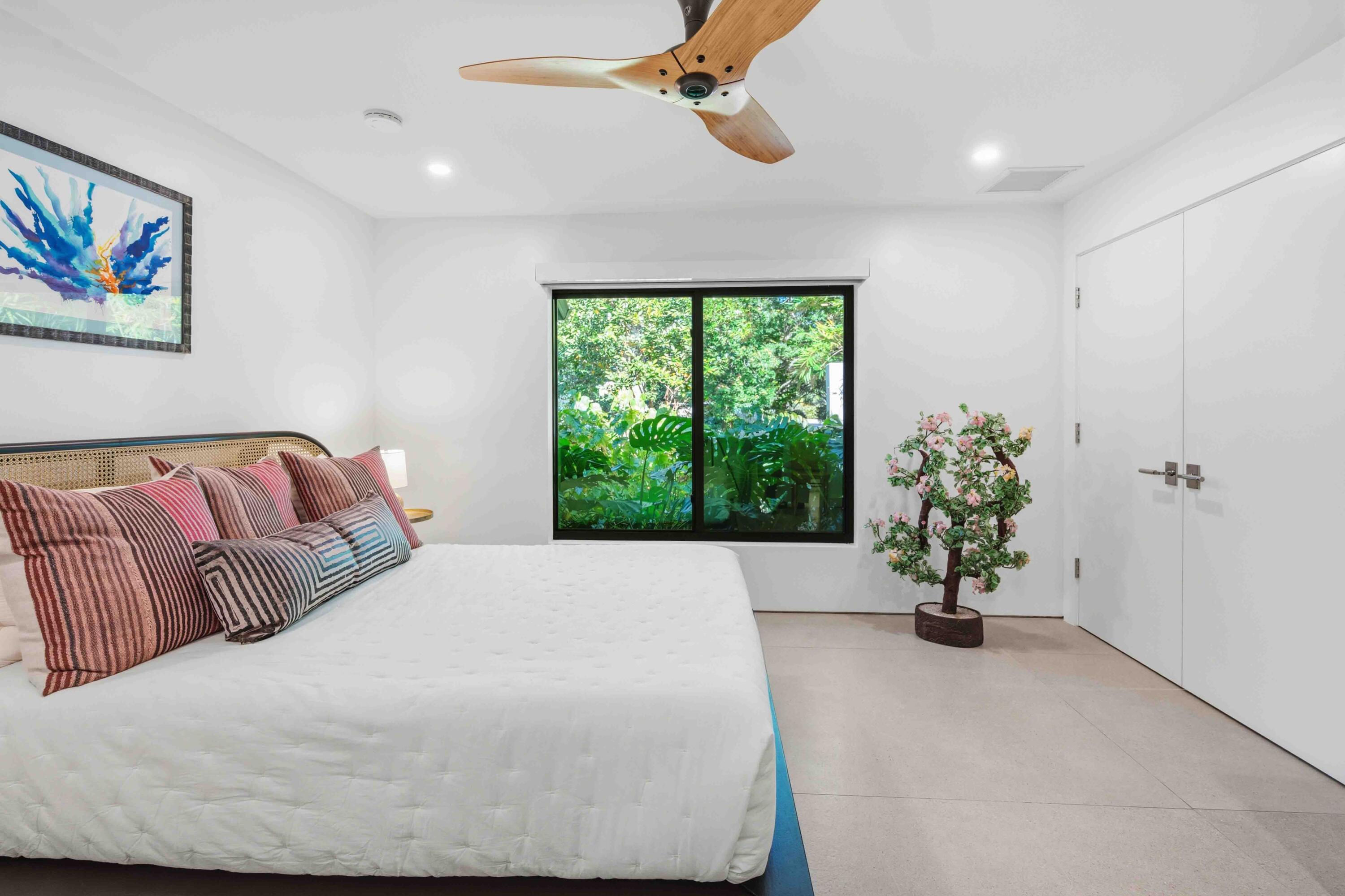18660 Long Lake Drive Boca Raton, FL 33496 - Photo 41 of 75 a bedroom with a large bed and a potted plant