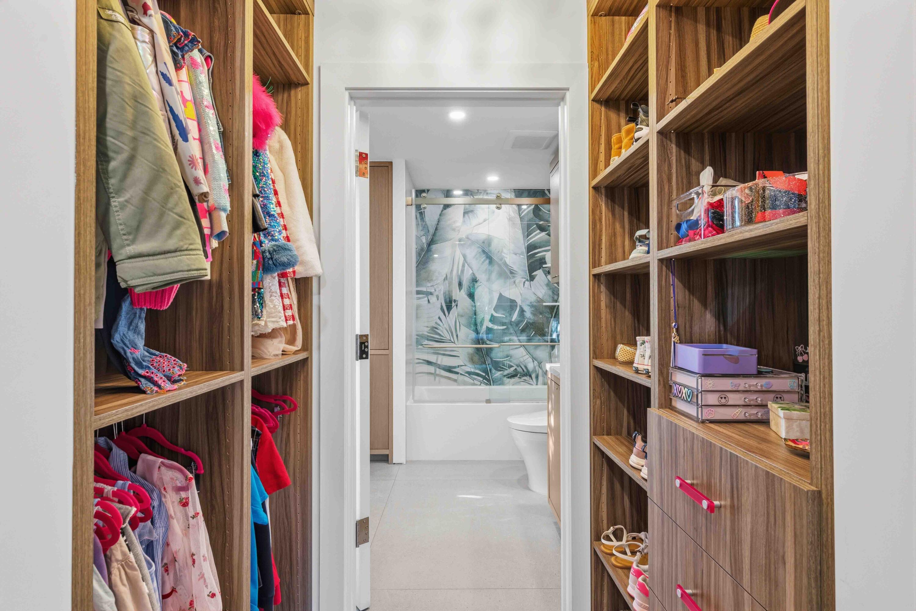 18660 Long Lake Drive Boca Raton, FL 33496 - Photo 44 of 75 a view of walk in closet with clothes and shoes