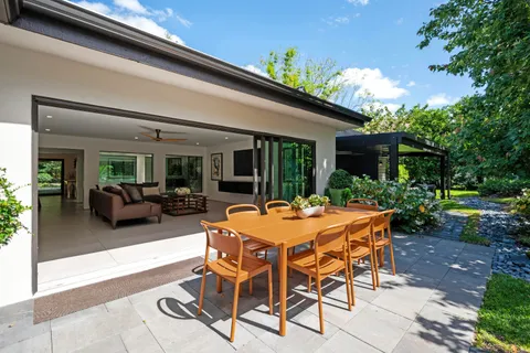 a backyard of a house with yard barbeque oven and outdoor seating