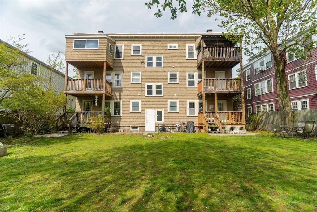 65 Rossmore Road, Unit 1R Boston, MA 02130 - Photo 19 of 21 front view of a building with a yard