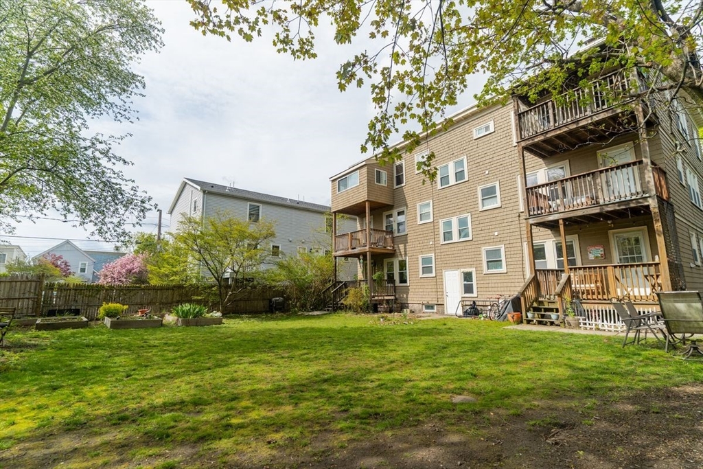 65 Rossmore Road, Unit 1R Boston, MA 02130 - Photo 2 of 21 a view of a building with a yard