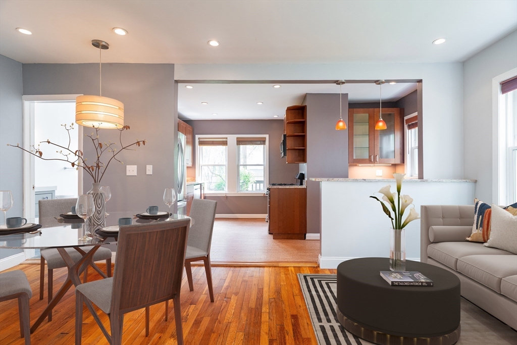65 Rossmore Road, Unit 1R Boston, MA 02130 - Photo 5 of 21 a living room with furniture a large window and wooden floor