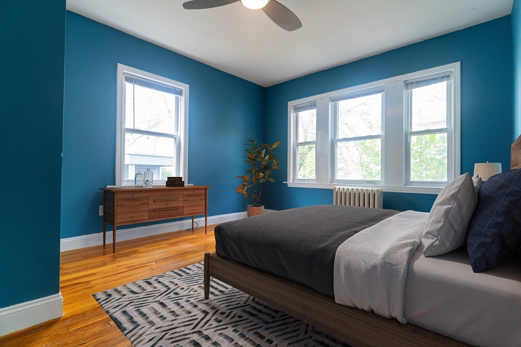 65 Rossmore Road, Unit 1R Boston, MA 02130 - Photo 9 of 21 a bedroom with a bed and window