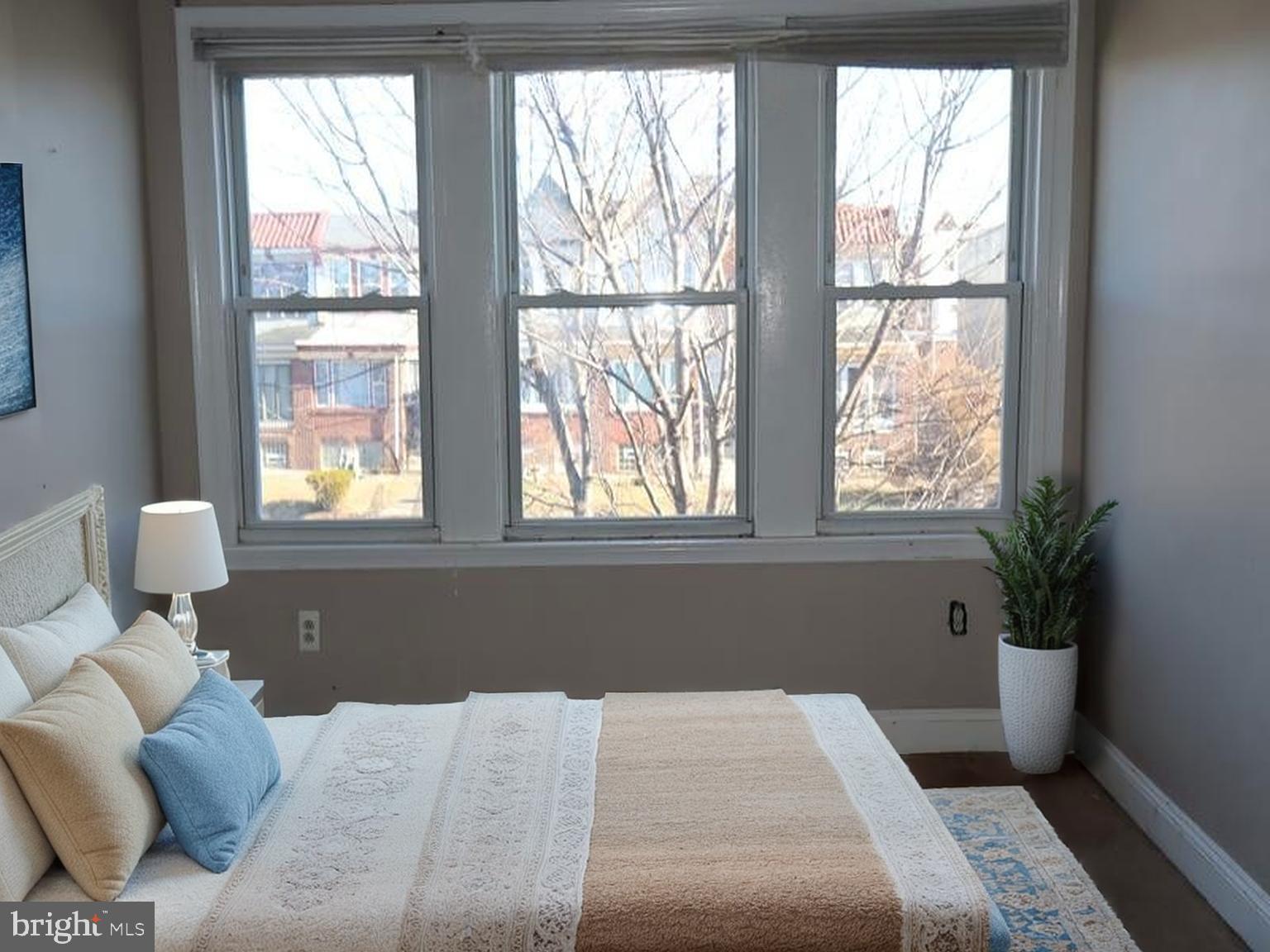 7330 Sommers Road Philadelphia, PA 19138 - Photo 21 of 30 a bedroom with a large bed and wooden floor