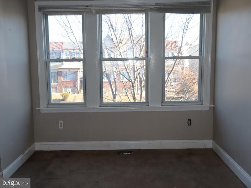 7330 Sommers Road Philadelphia, PA 19138 - Photo 22 of 30 an empty room with wooden floor and windows
