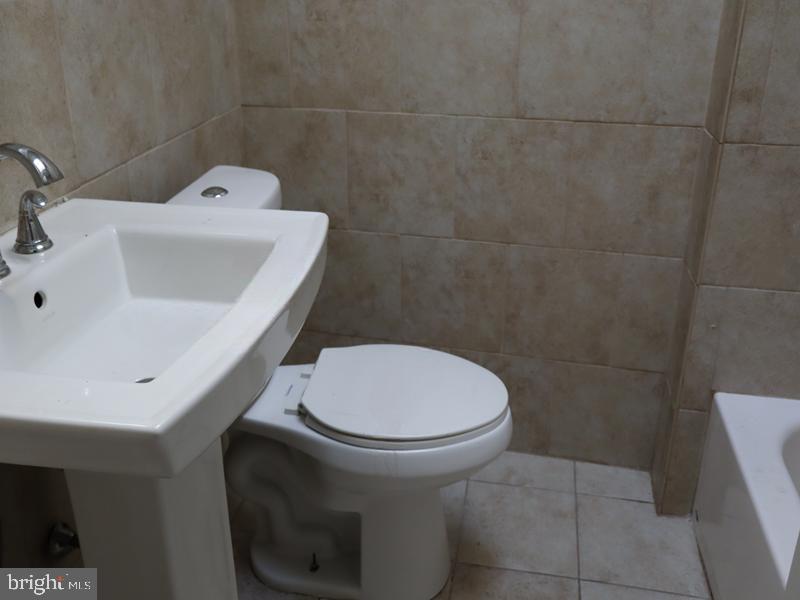 7330 Sommers Road Philadelphia, PA 19138 - Photo 29 of 30 a bathroom with a toilet and a sink