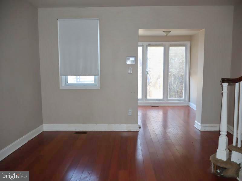 7330 Sommers Road Philadelphia, PA 19138 - Photo 8 of 30 an empty room with wooden floor and windows