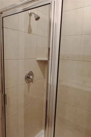 a white toilet sitting next to a white sink