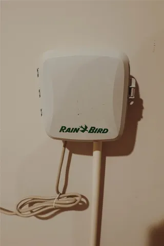 a view of a lake with a yard and outdoor seating