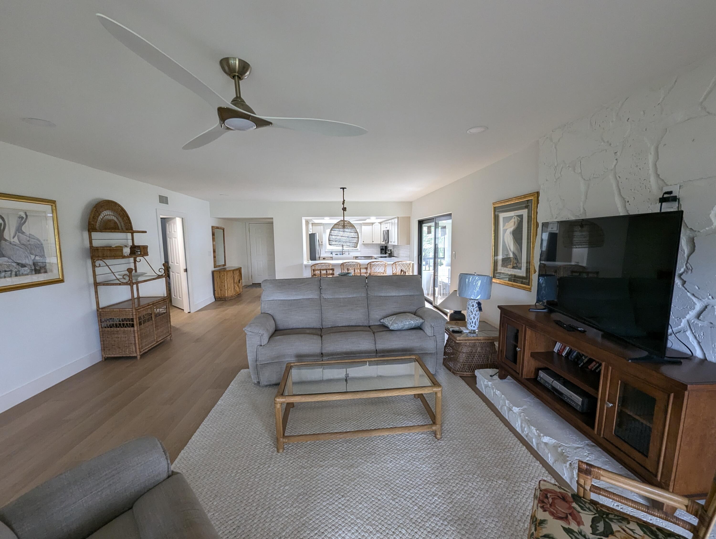 404 Clubhouse Circle Jupiter, FL 33477 - Photo 11 of 20 a living room with furniture and a flat screen tv