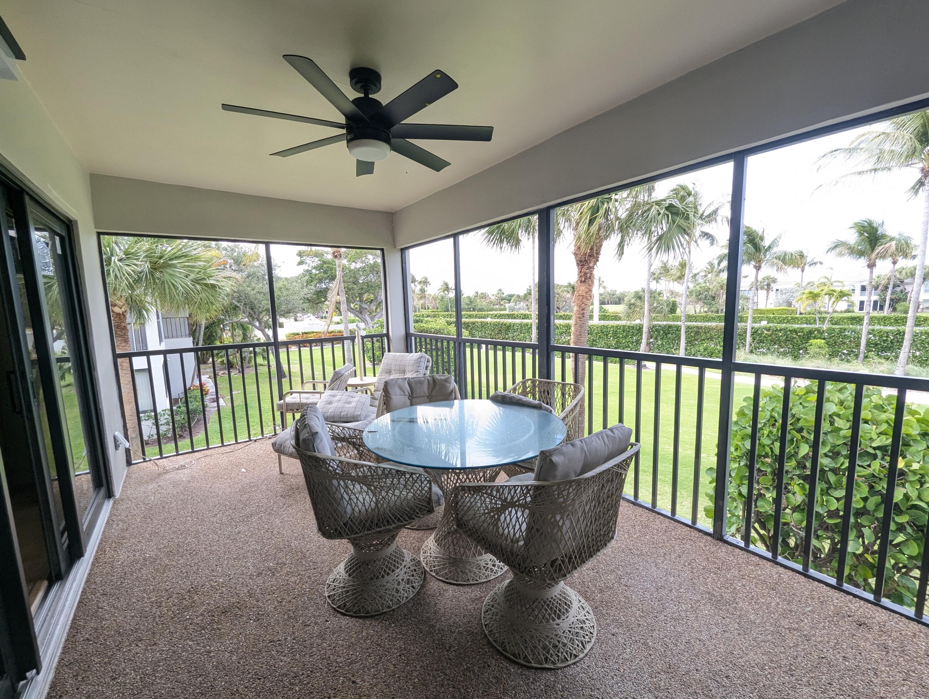 404 Clubhouse Circle Jupiter, FL 33477 - Photo 12 of 20 a dining room with furniture window and outside view