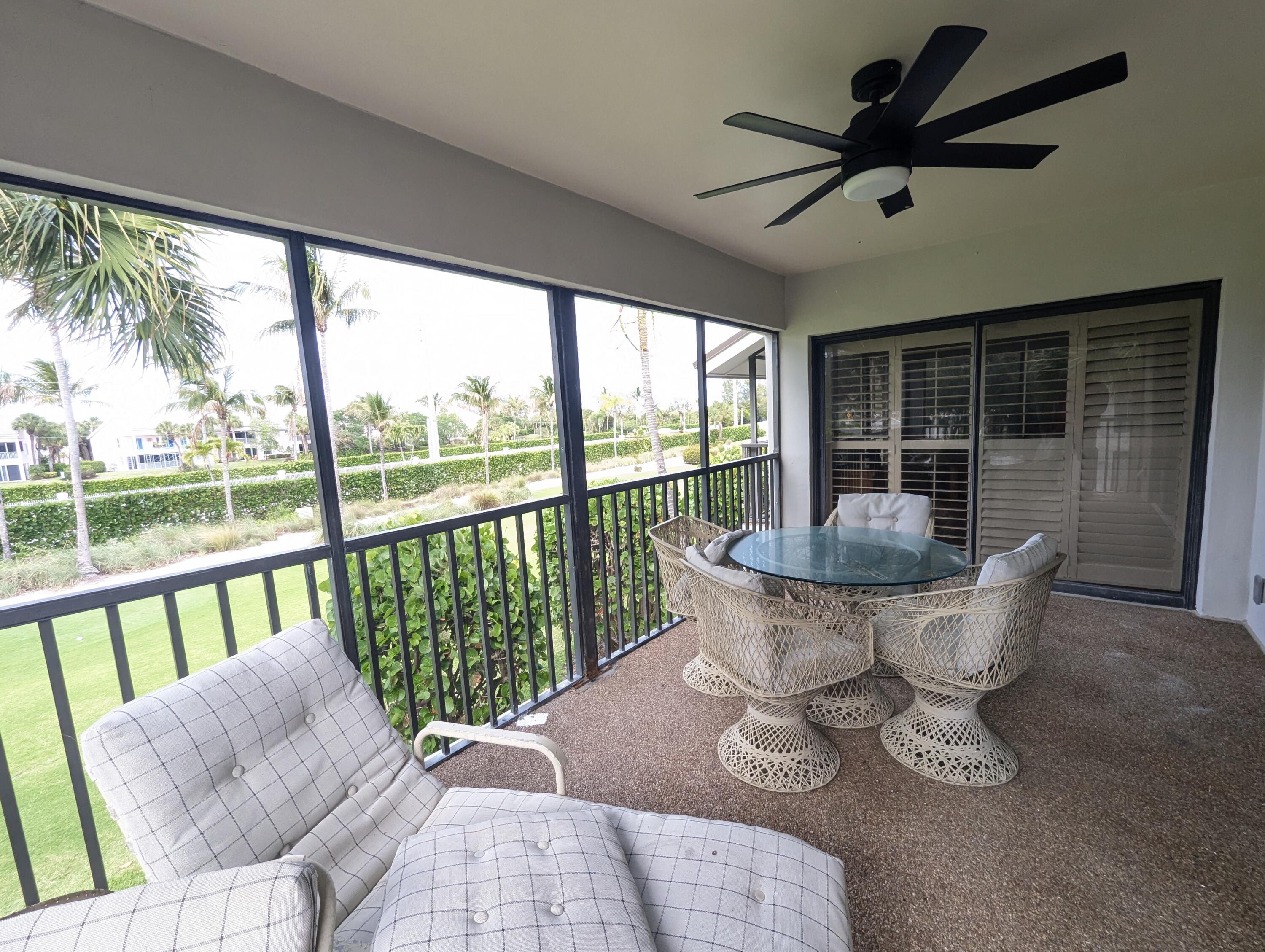 404 Clubhouse Circle Jupiter, FL 33477 - Photo 13 of 20 a living room with furniture and a large window