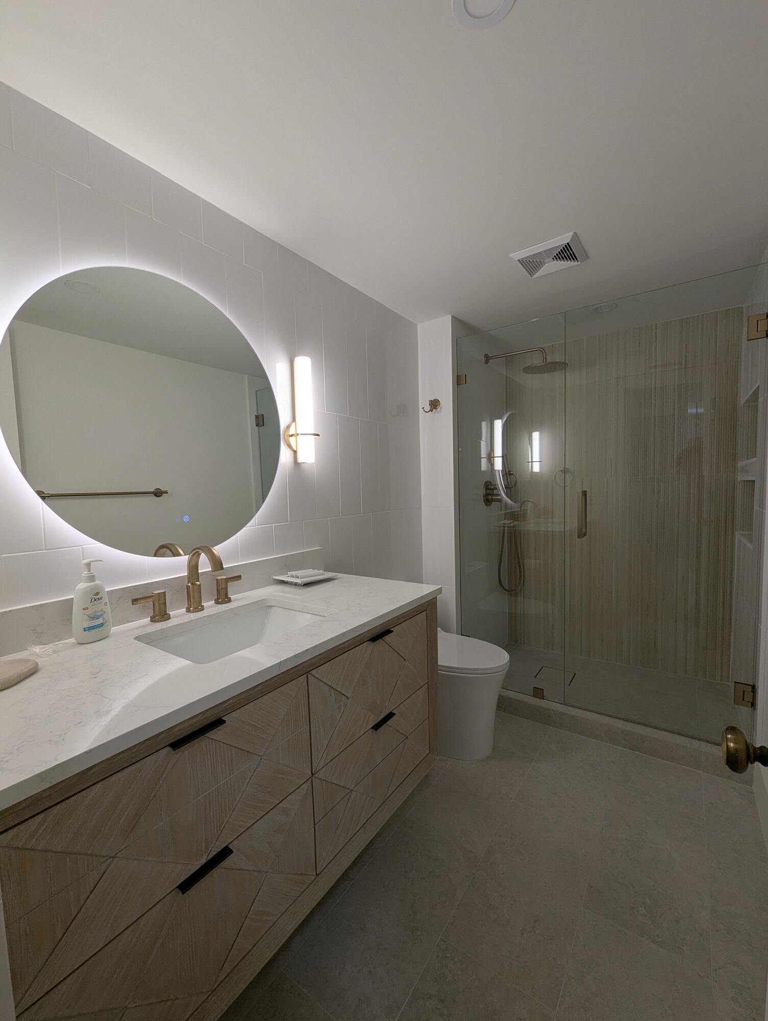 404 Clubhouse Circle Jupiter, FL 33477 - Photo 20 of 20 a bathroom with a double vanity sink and a mirror