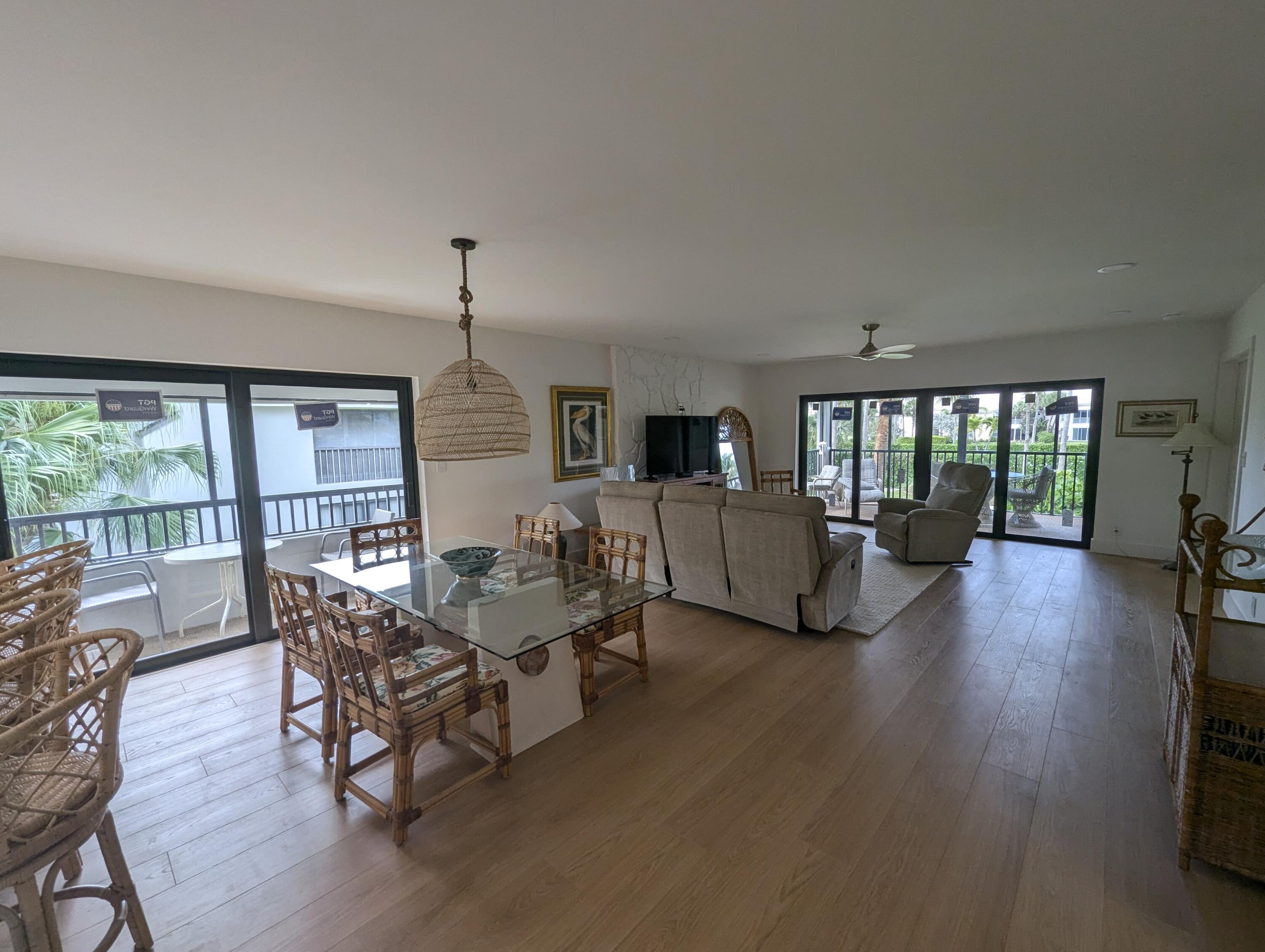 404 Clubhouse Circle Jupiter, FL 33477 - Photo 3 of 20 a living room with furniture and a wooden floor