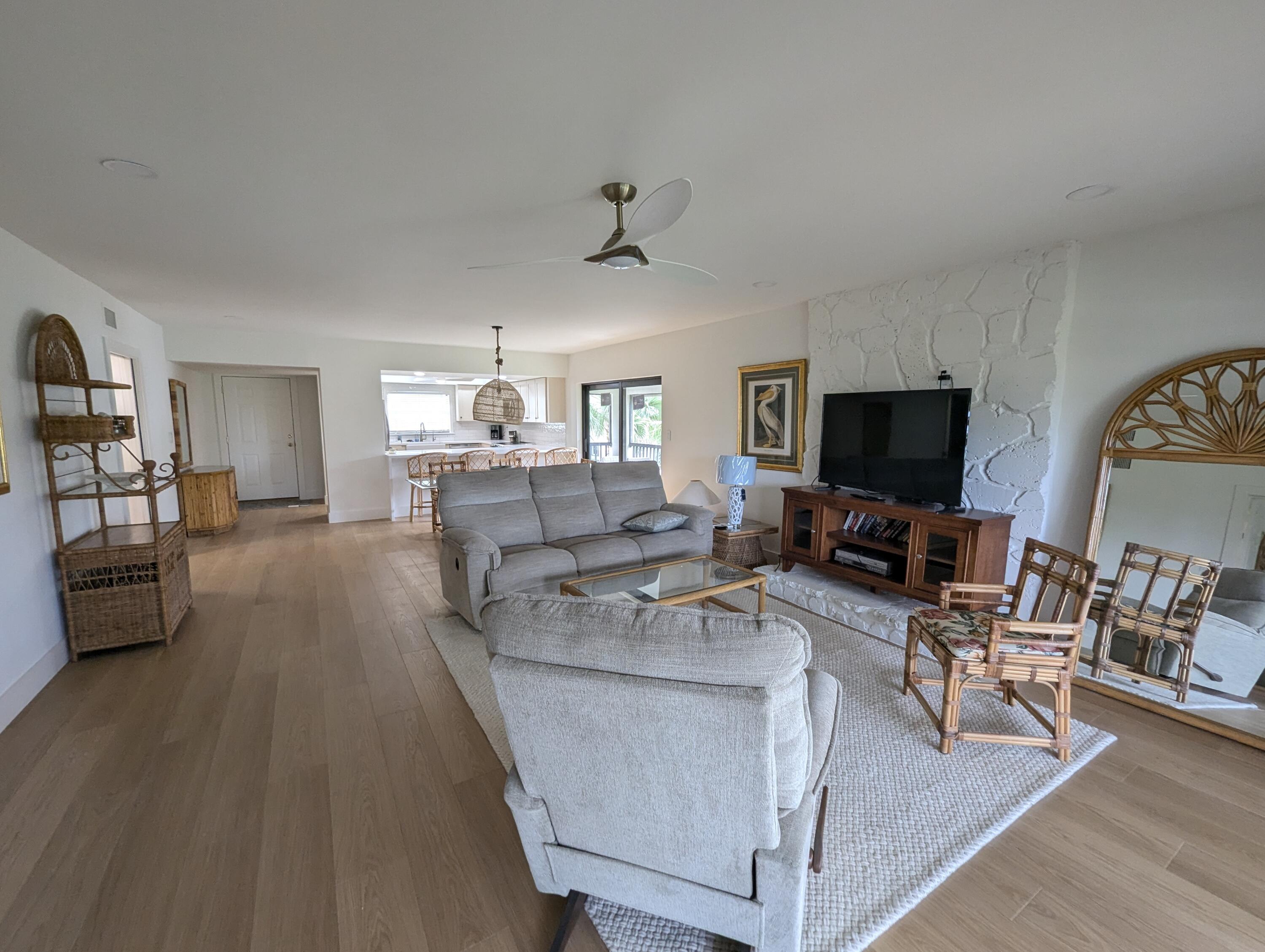 404 Clubhouse Circle Jupiter, FL 33477 - Photo 10 of 20 a living room with furniture and a flat screen tv