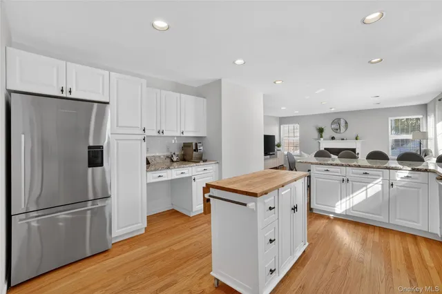 a kitchen with a stove a sink and a refrigerator