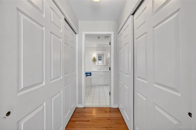 a bedroom with a bed and a lamp