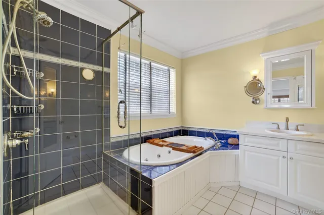 a view of a hallway with white walls and a white door