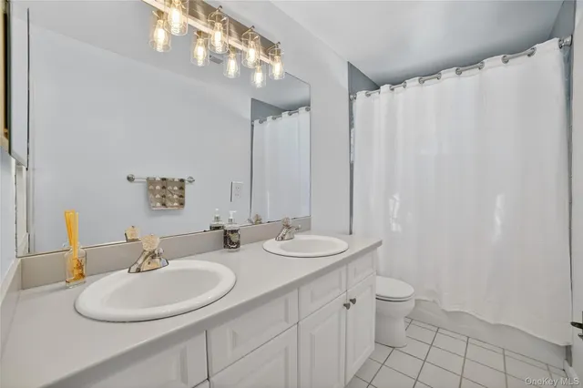 a large white bed in a white room