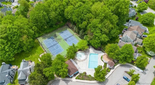 a view of a patio with a table and chairs