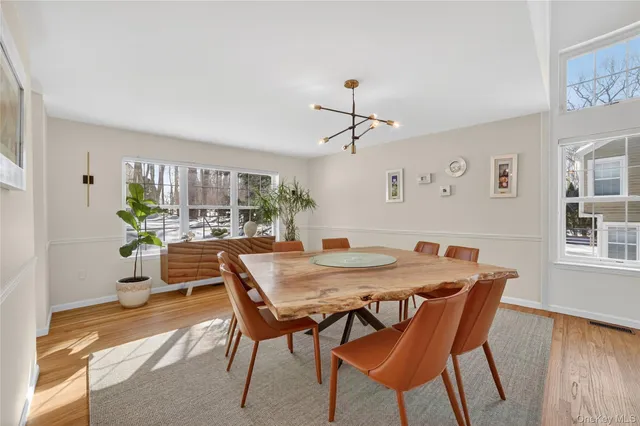 a living room with furniture and flowers