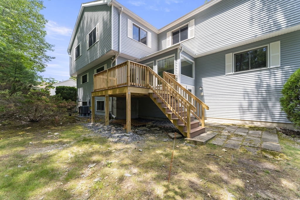 22 Arrowhead Circle, Unit 22 Ashland, MA 01721 - Photo 2 of 35 a view of a house with a yard