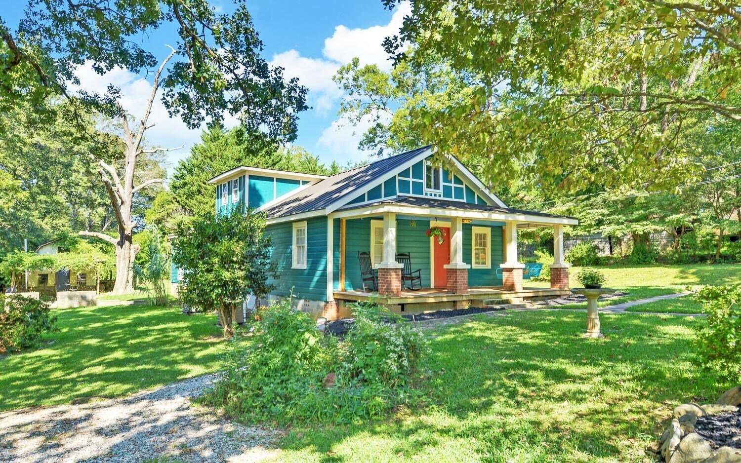 a front view of a house with garden