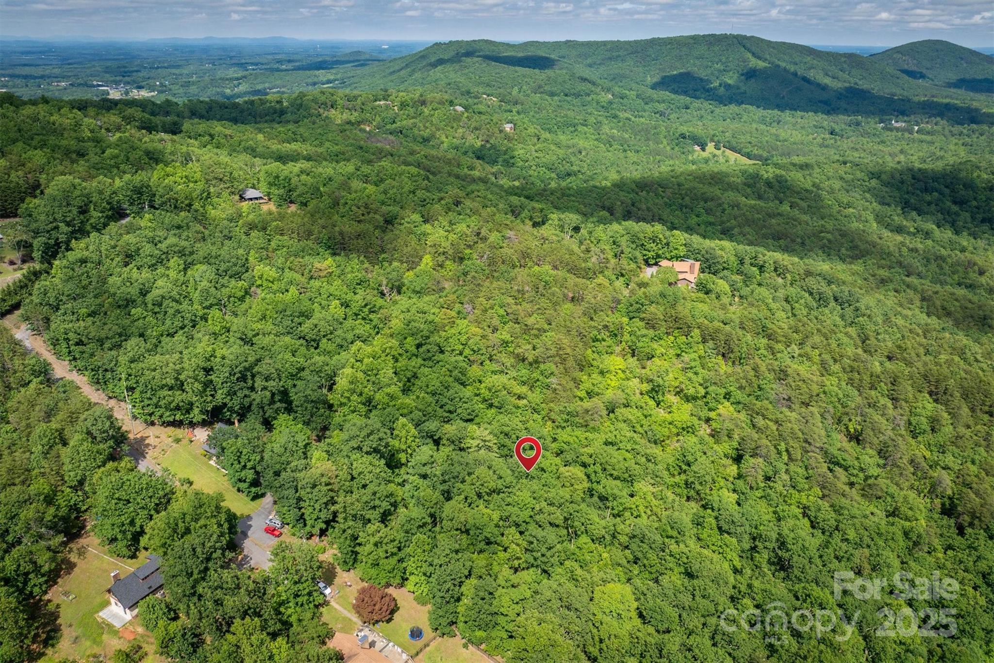 0 Methodist Park Road Valdese, NC 28690 - Photo 4 of 11 a view of a lush green forest with a lush green hillside and tennis court