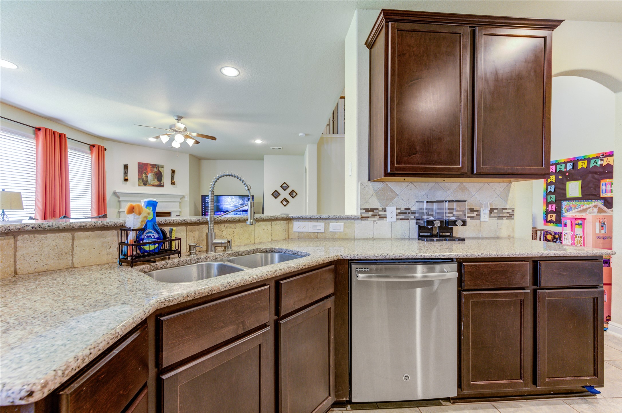 24511 Stratton Creek Drive Spring, TX 77373 - Photo 12 of 27 Plenty of Workspace – Granite countertops provide ample room for meal preparation, baking, and entertaining, making this kitchen both practical and efficient.