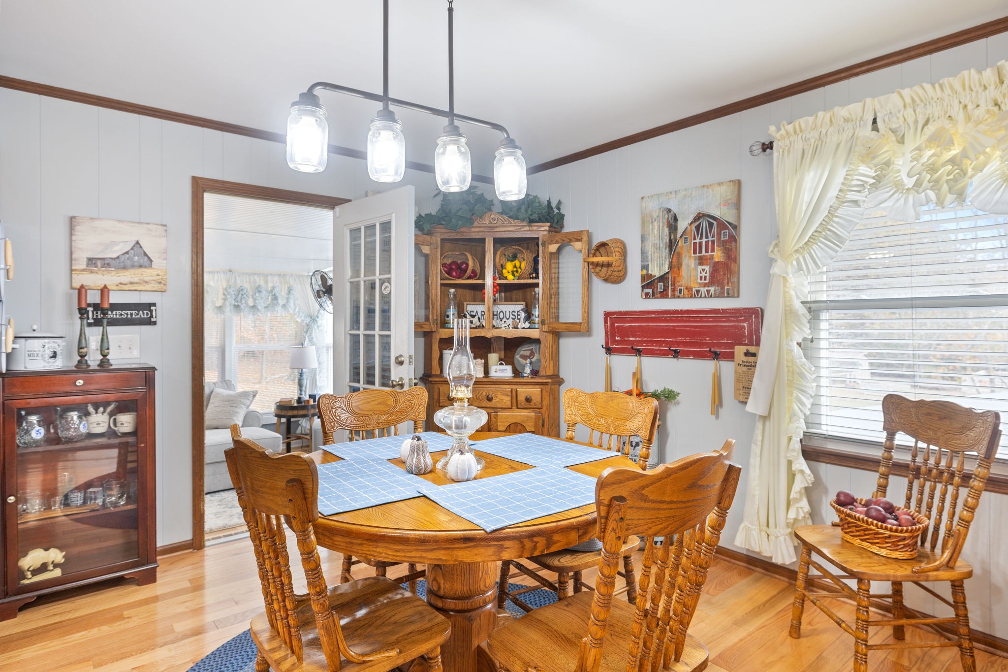 272 Belmar Circle Manchester, TN 37355 - Photo 11 of 56 a view of a dining room with furniture a chandelier and wooden floor