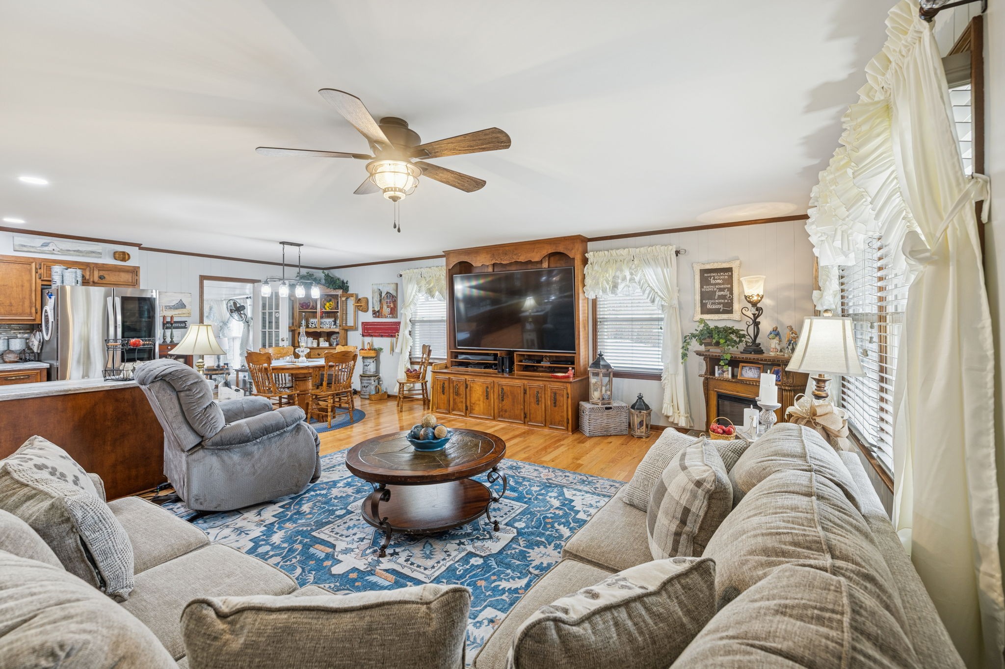 272 Belmar Circle Manchester, TN 37355 - Photo 14 of 56 a living room with furniture a flat screen tv and kitchen view