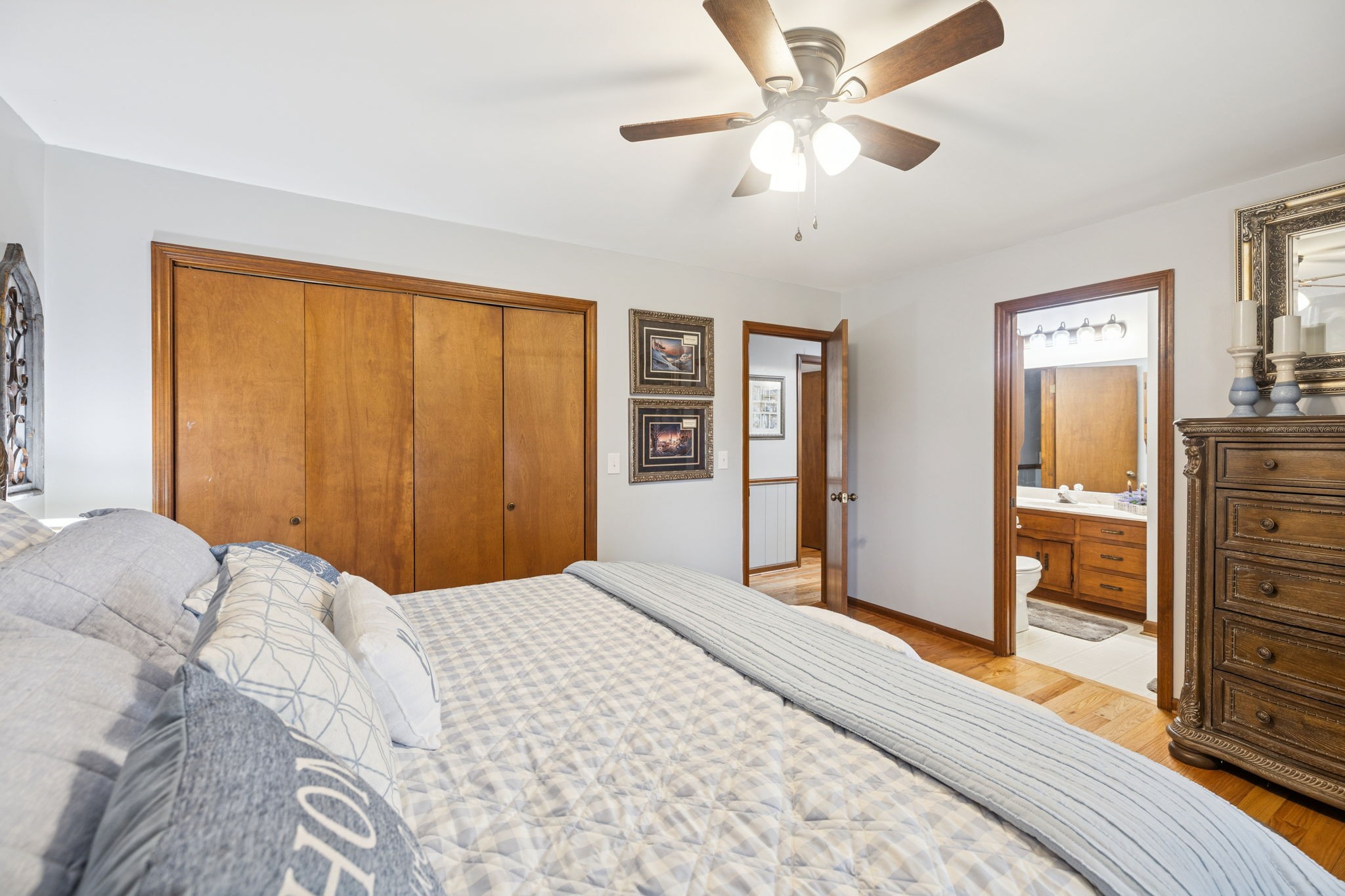 272 Belmar Circle Manchester, TN 37355 - Photo 18 of 56 a bedroom with a large bed a chandelier and closet