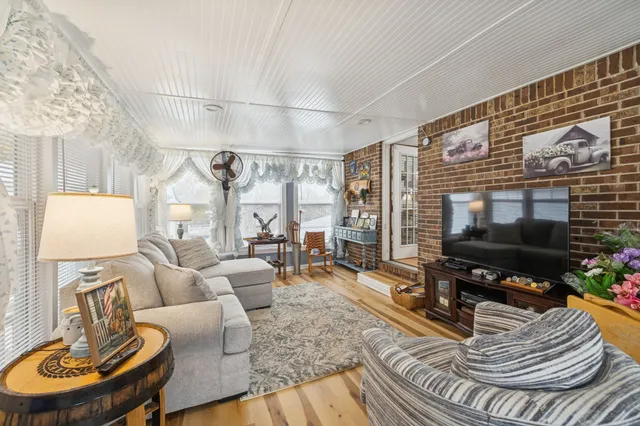 a view of an entryway with wooden floor