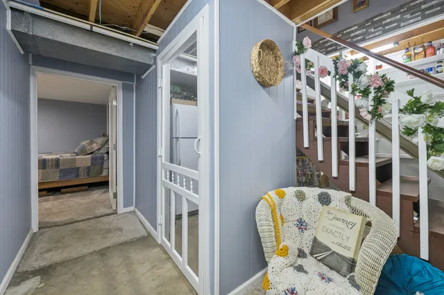 a bed room with furniture and a table