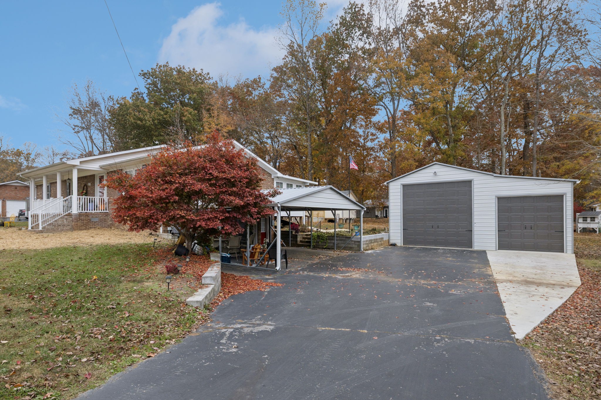 272 Belmar Circle Manchester, TN 37355 - Photo 41 of 56 a front view of a house with a yard and garage