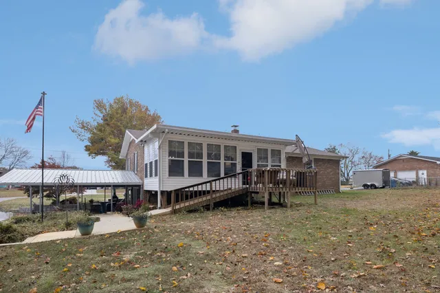 an aerial view of a house with yard swimming pool and outdoor seating