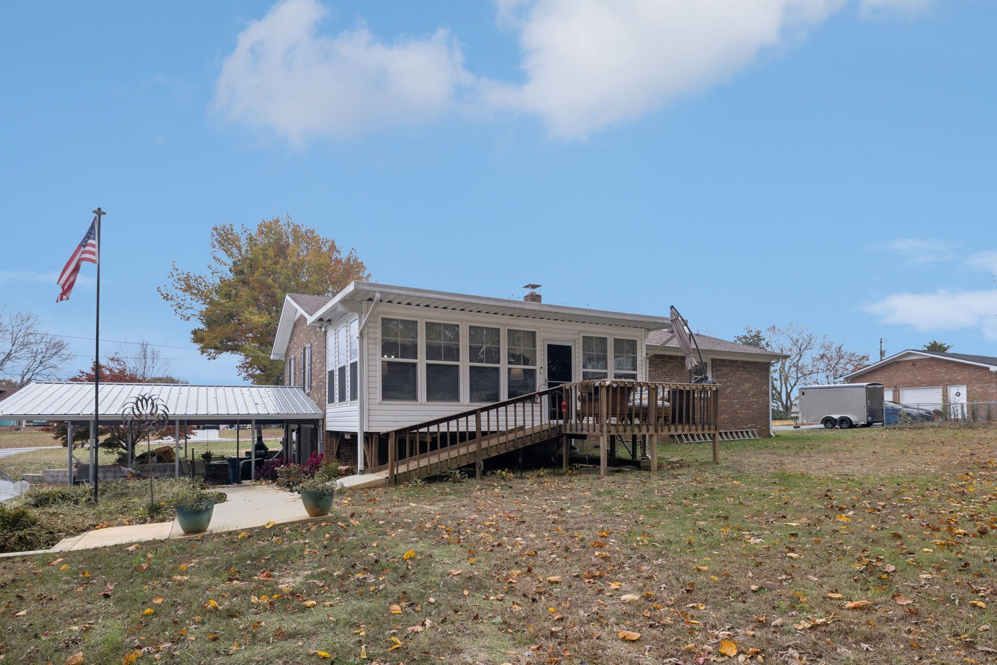 272 Belmar Circle Manchester, TN 37355 - Photo 44 of 56 a view of a house with a wooden deck and a yard