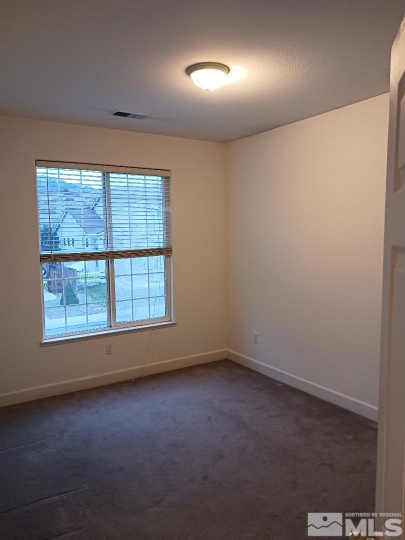 2217 Table Rock Drive Carson City, NV 89706 - Photo 16 of 28 an empty room with a empty space and windows