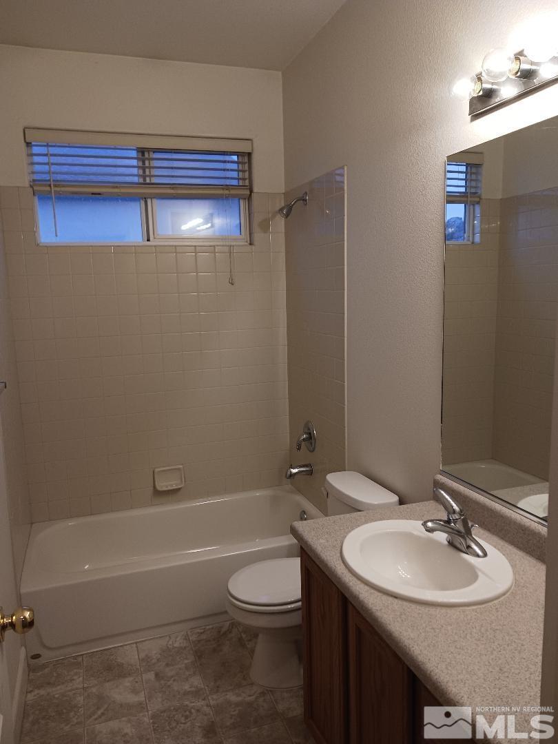 2217 Table Rock Drive Carson City, NV 89706 - Photo 20 of 28 a bathroom with a sink a toilet and shower