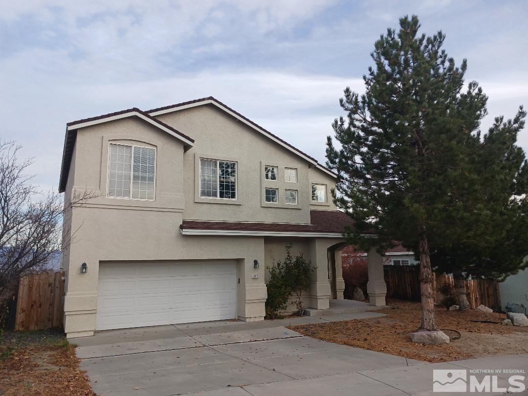 2217 Table Rock Drive Carson City, NV 89706 - Photo 2 of 28 a front view of a house with garage
