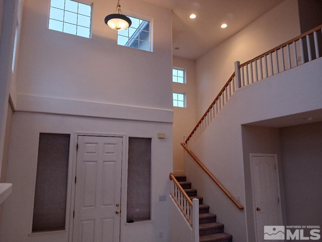 2217 Table Rock Drive Carson City, NV 89706 - Photo 3 of 28 a view of staircase with lots of frames on wall and a window