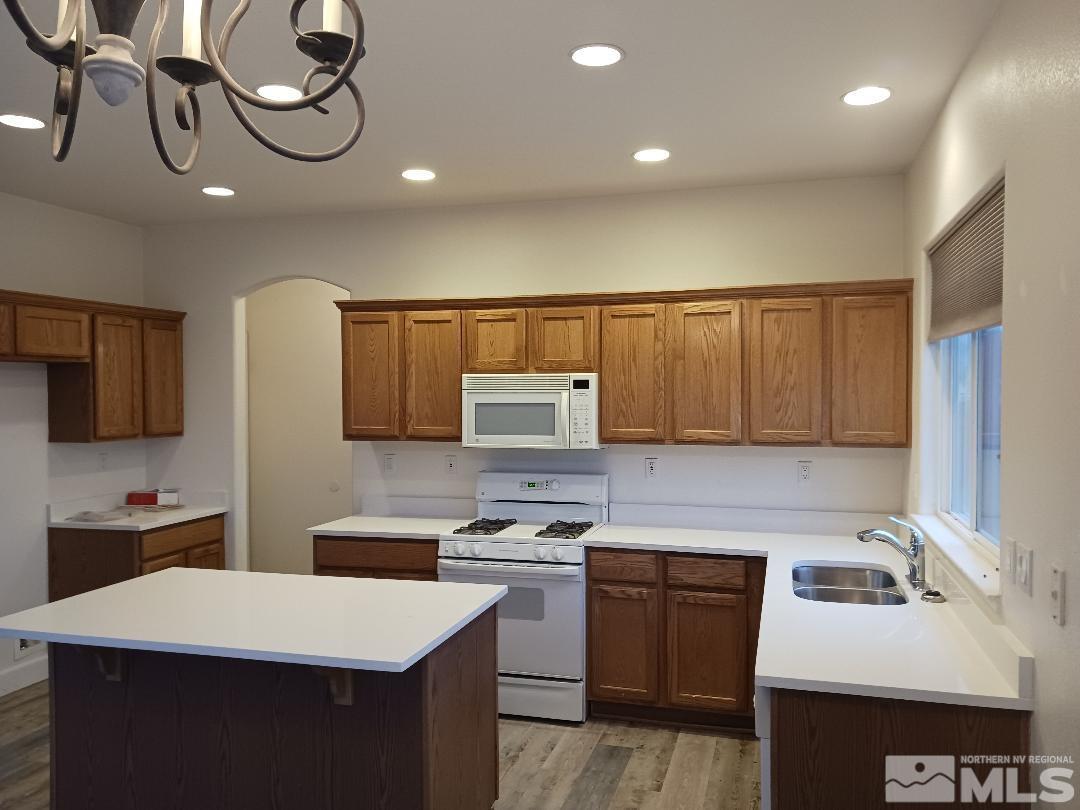 2217 Table Rock Drive Carson City, NV 89706 - Photo 6 of 28 a kitchen with a sink a stove and cabinets